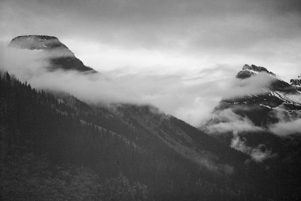 Mountain partially covered with clouds-Glacier National Park-Montana